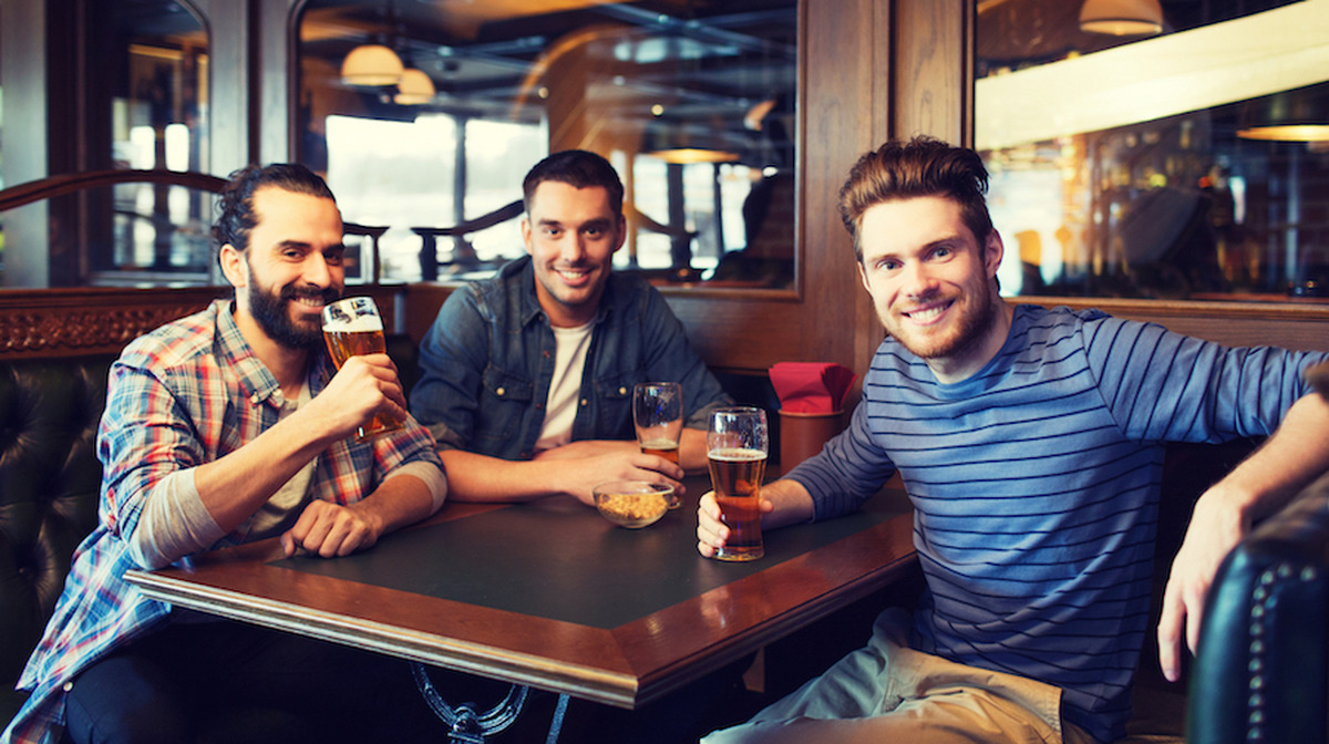 happy male friends drinking beer at bar or pub