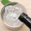 Bottle,Of,Japanese,Shochu,And,Ceramic,Bowl,On,Bamboo,Table