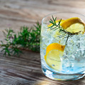 Gin,With,Lemon,And,Juniper,Branch,On,A,Old,Wooden