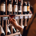 Bartender,Or,Male,Cavist,Standing,Near,The,Shelves,Of,Wine