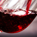 Glass,Of,Full,Bodied,Red,Wine,Being,Poured,From,Bottle