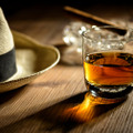 Glas,Of,Rum,,Cigar,And,A,Panama,Hat,In,A